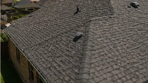Severe thunderstorm over a McAllen, Texas neighborhood with storm debris in the street